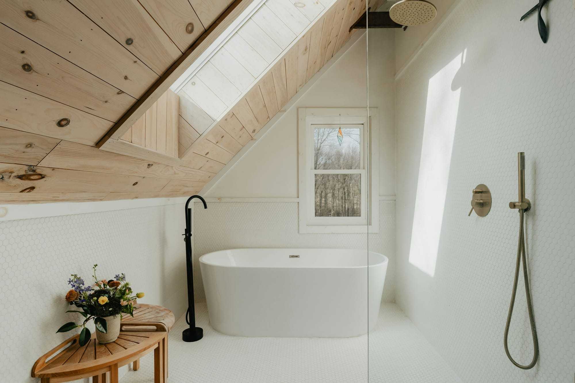 A freestanding bath under a sloping ceiling